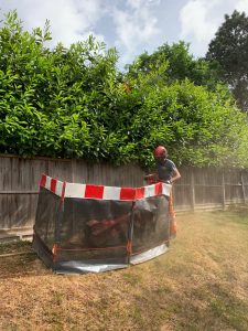 An image of someone mowing a lawn